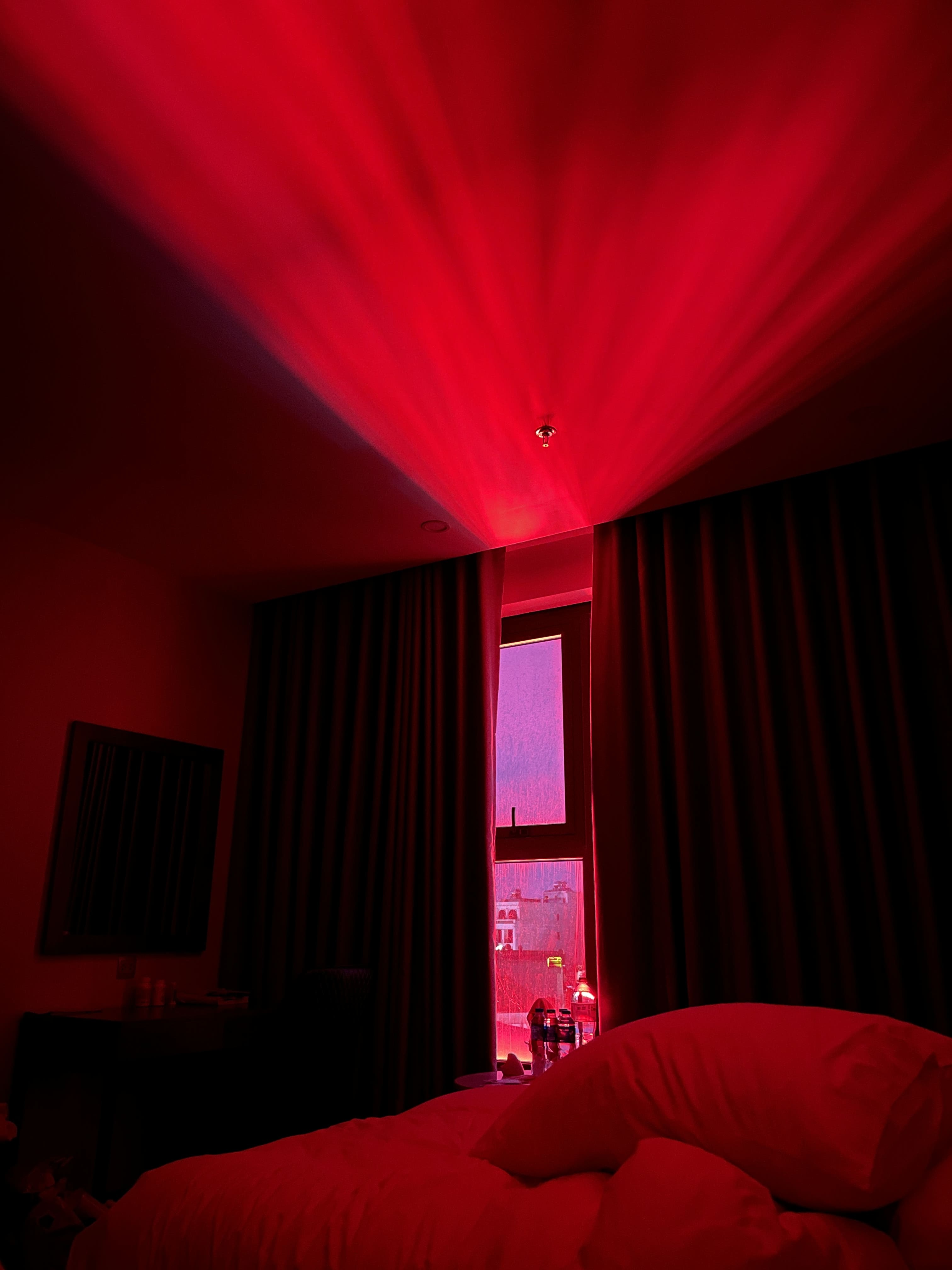 The room that I sleeps in has a neon light right in front of the windows, I woke up one night and saw this, felt like a horror movie